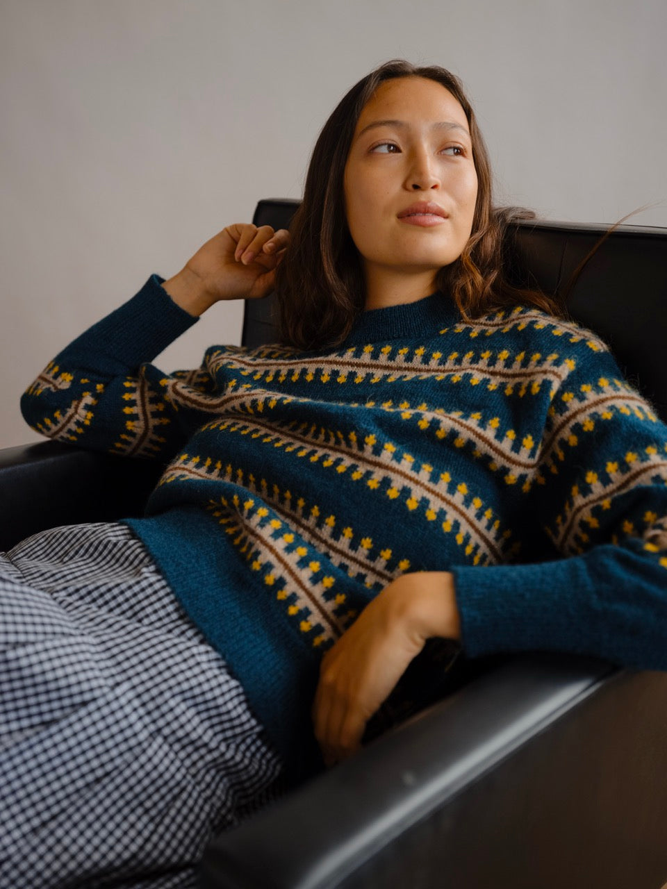 The Endery Vera Fairisle Sweater in Juniper — a deep teal fair isle knit banded with mustard, cream and warm brown, in alpaca