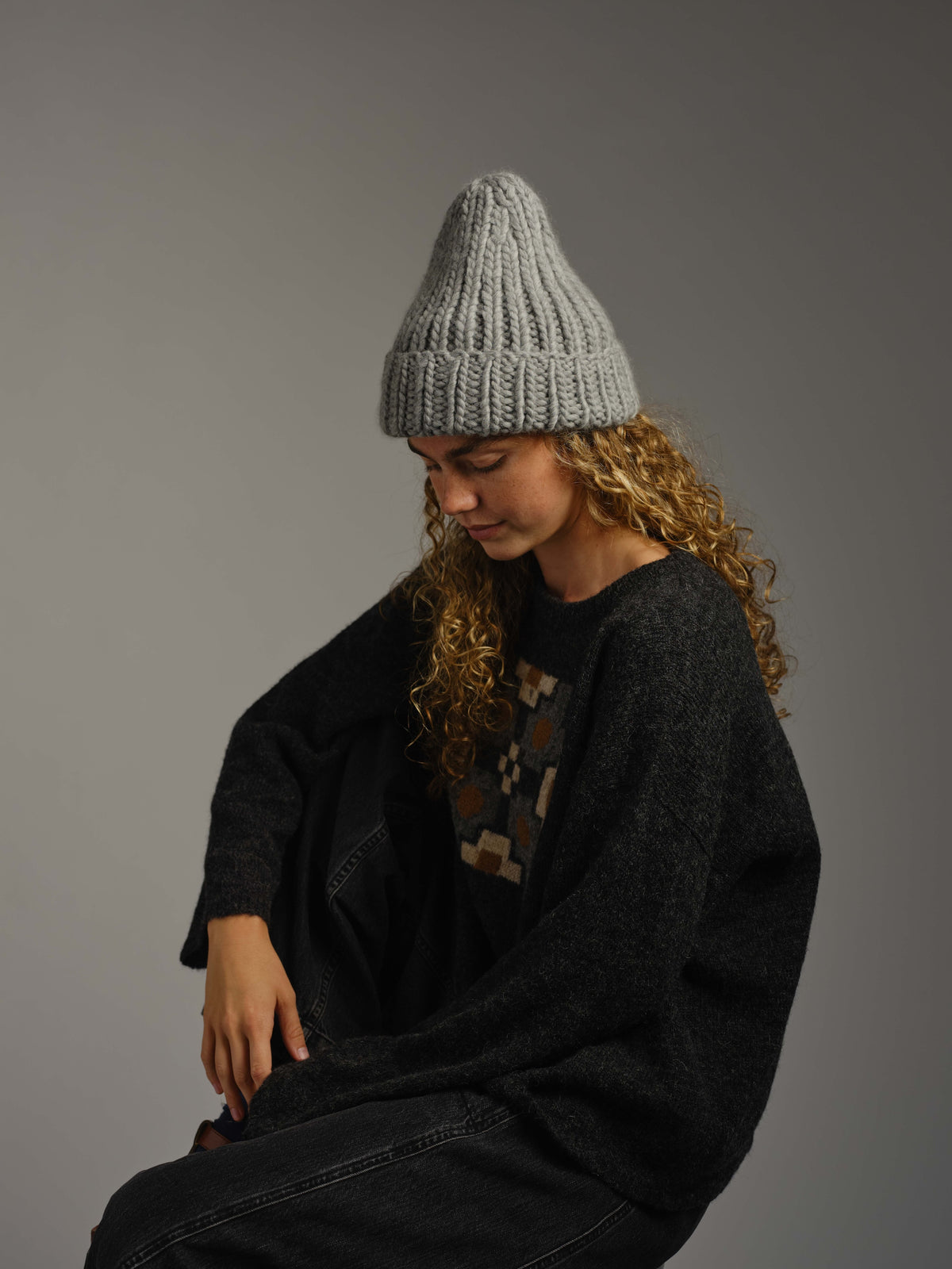 The Workwear merino beanie in Pewter, worn — alternate view
