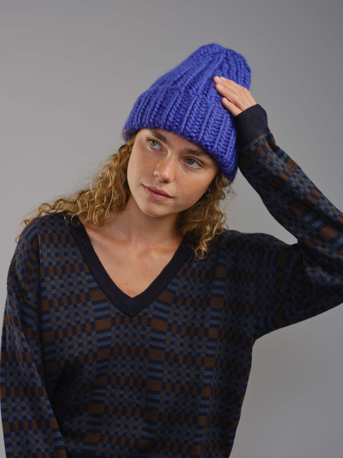 The Workwear merino beanie in Lapis, worn — alternate view