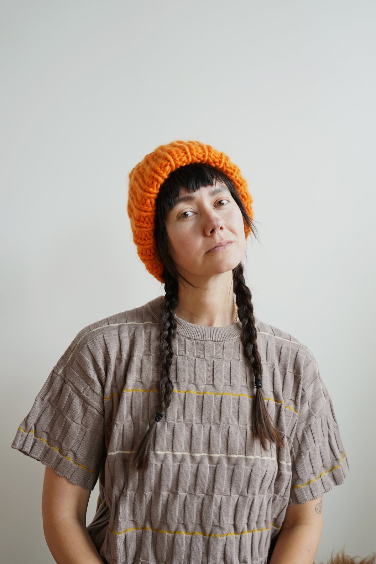 The Workwear hand-knit merino wool beanie in Persimmon — product view