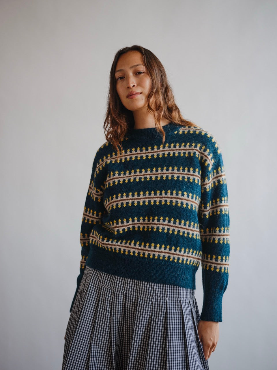 The Endery Vera Fairisle Sweater in Juniper — a deep teal fair isle knit banded with mustard, cream and warm brown, in alpaca