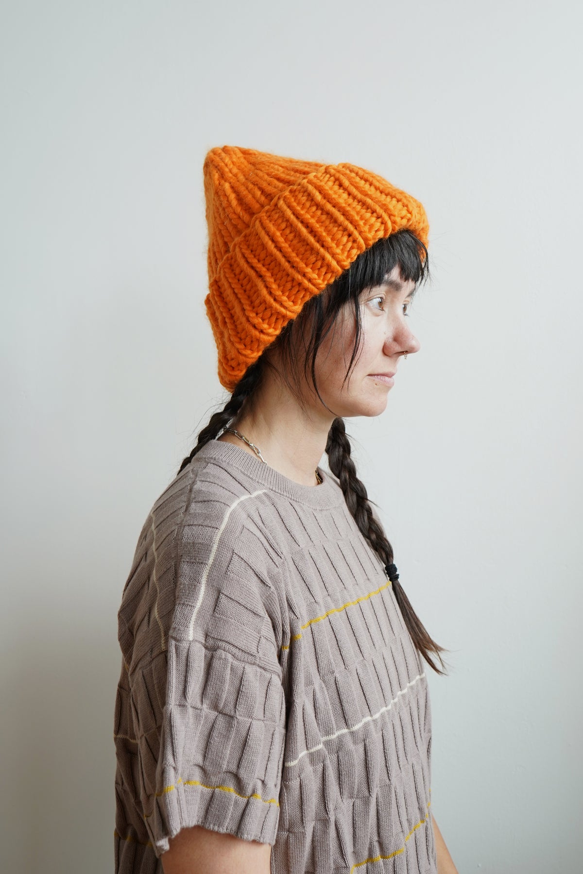 The Workwear hand-knit merino wool beanie in Persimmon — product view