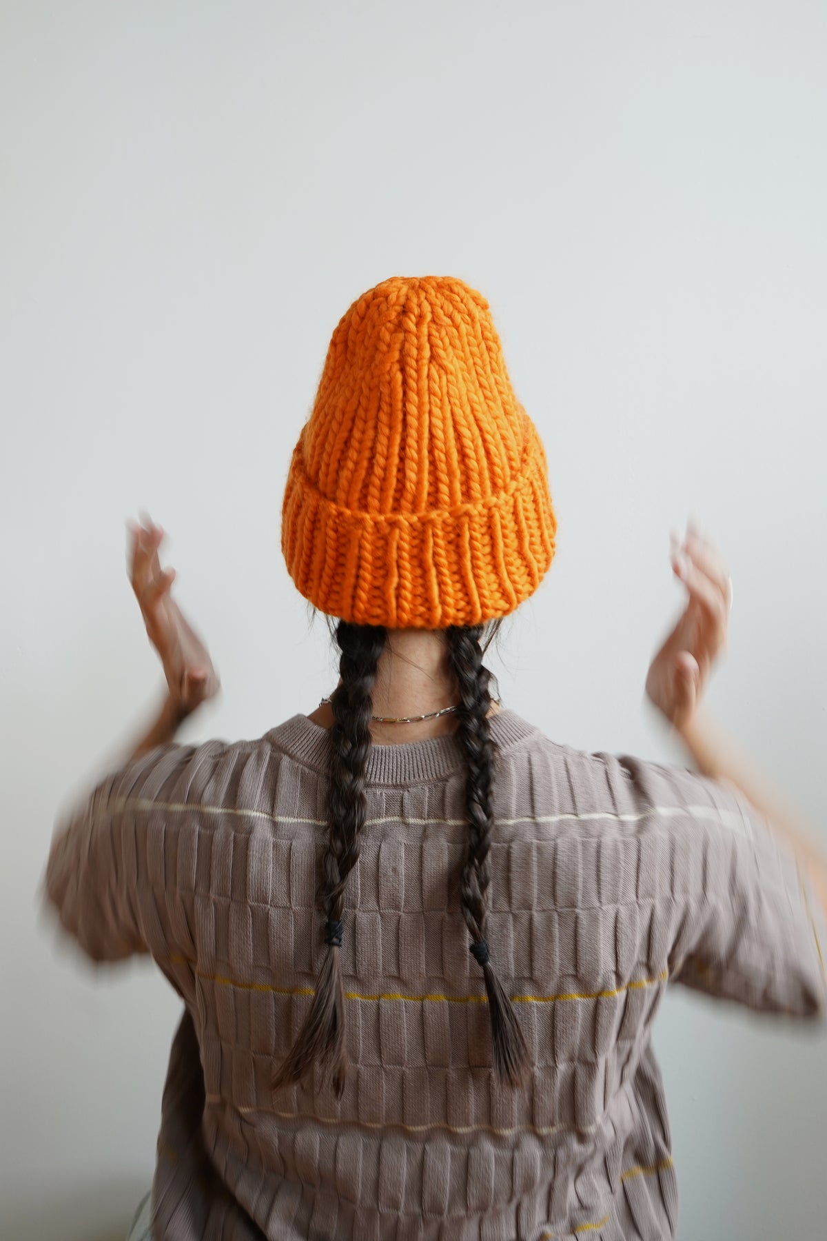 The Workwear hand-knit merino wool beanie in Persimmon — product view