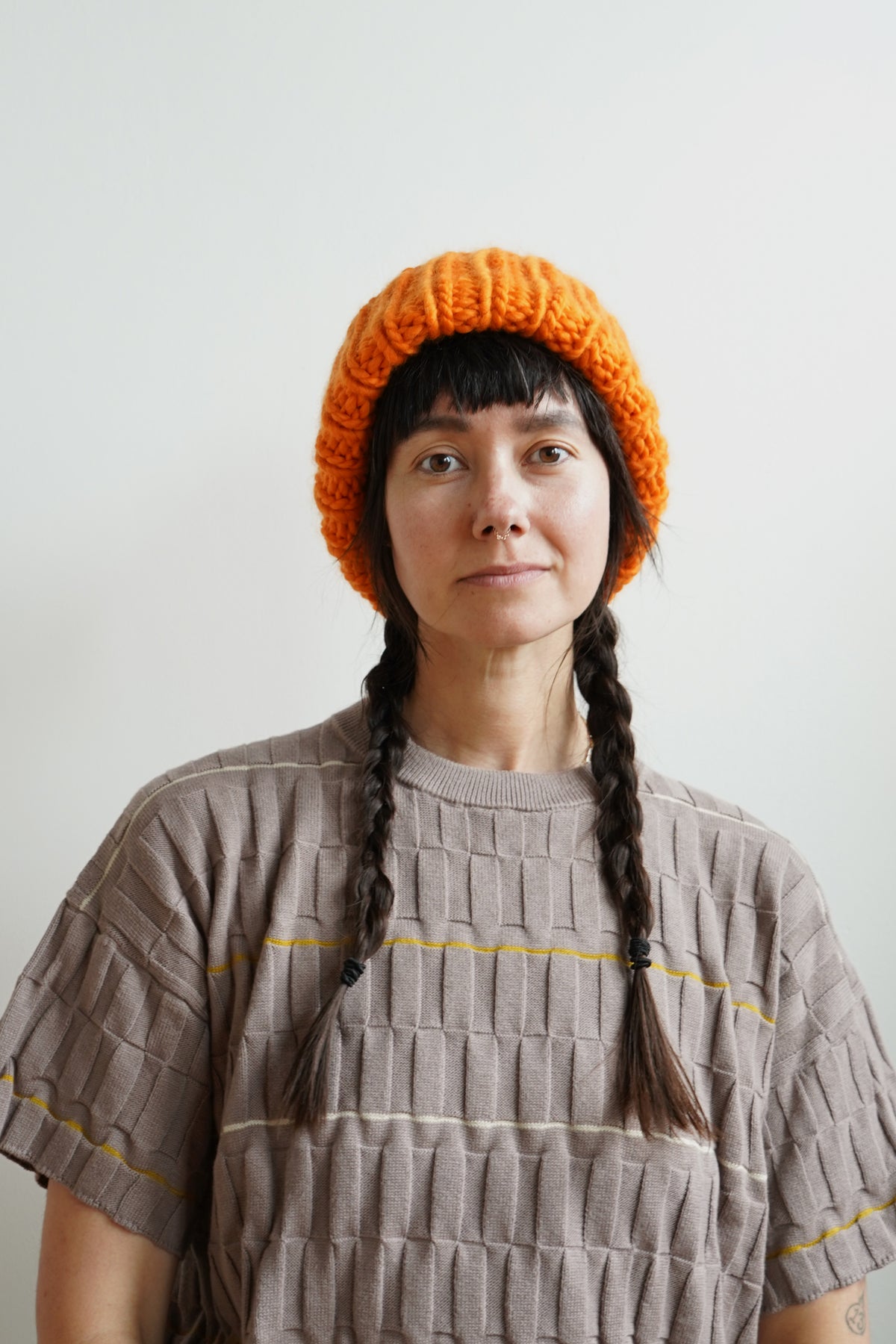 The Workwear hand-knit merino wool beanie in Persimmon — product view